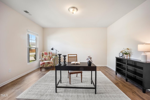 office space featuring wood finished floors and baseboards