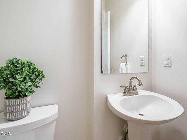 2213 Ravens Creek Ct, Raleigh, NC 27603 - half bathroom featuring a sink and toilet
