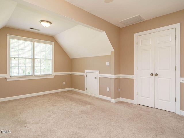2213 Ravens Creek Ct, Raleigh, NC 27603 - additional living space featuring lofted ceiling, visible vents, and carpet floors