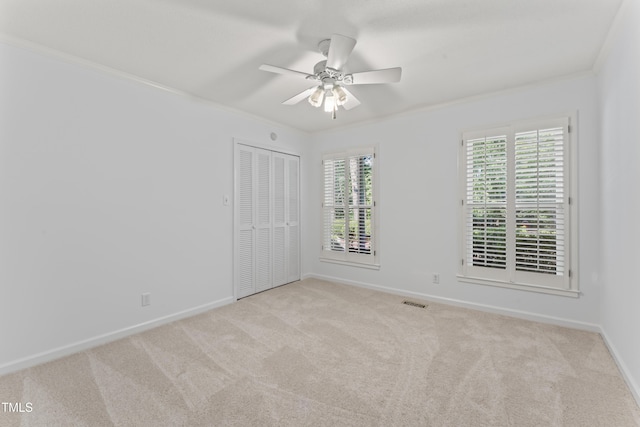 3911 Hope Valley Rd, Durham, NC 27707 - carpeted empty room with crown molding, a ceiling fan, and baseboards