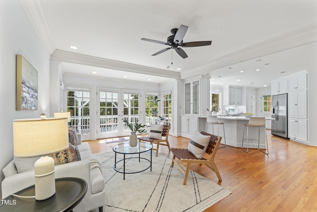 3911 Hope Valley Rd, Durham, NC 27707 - living area with crown molding, a ceiling fan, light wood-type flooring, and recessed lighting