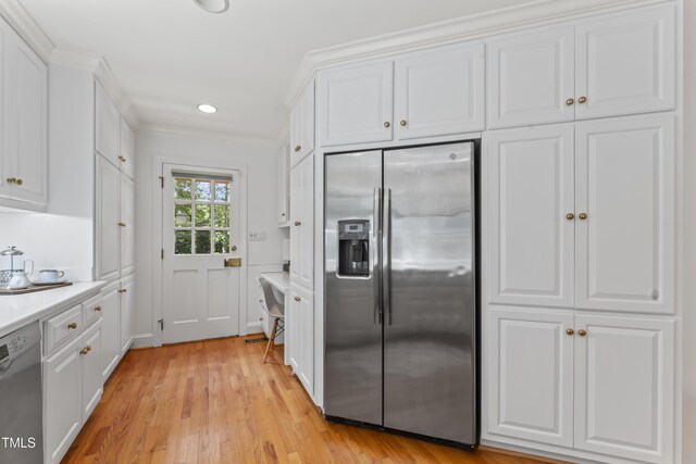 3911 Hope Valley Rd, Durham, NC 27707 - kitchen featuring stainless steel fridge, dishwasher, white cabinetry, light countertops, and light wood-type flooring