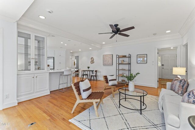 3911 Hope Valley Rd, Durham, NC 27707 - living room featuring ceiling fan, light wood-type flooring, recessed lighting, crown molding, and baseboards