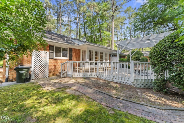 3911 Hope Valley Rd, Durham, NC 27707 - back of property featuring brick siding, a deck, and a pergola