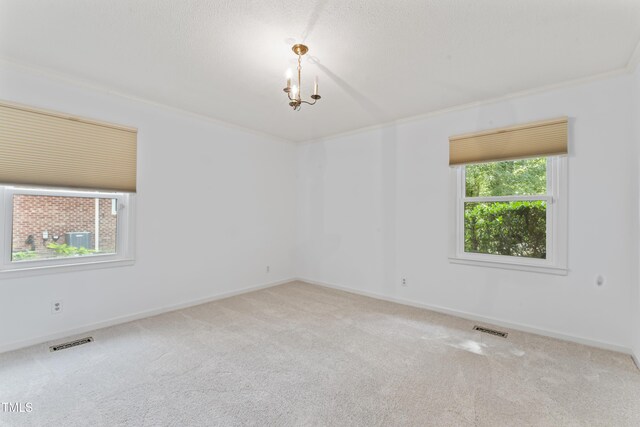 3911 Hope Valley Rd, Durham, NC 27707 - spare room featuring carpet flooring, baseboards, crown molding, and a chandelier