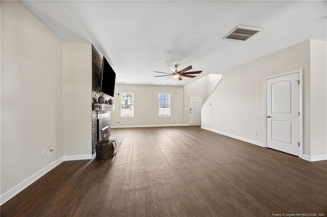 4644 Woodline Dr, Fayetteville, NC 28314 - unfurnished living room featuring baseboards, dark wood-style flooring, ceiling fan, visible vents, and a fireplace