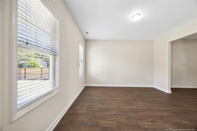 4644 Woodline Dr, Fayetteville, NC 28314 - spare room featuring visible vents, dark wood-style flooring, and baseboards