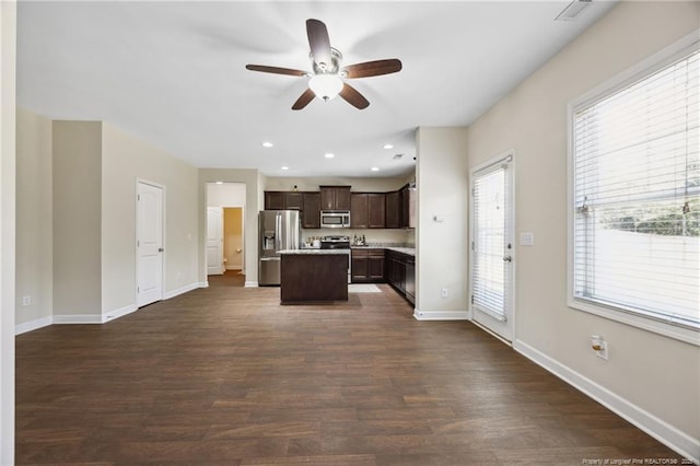 4644 Woodline Dr, Fayetteville, NC 28314 - kitchen featuring light countertops, a ceiling fan, a kitchen island, dark brown cabinets, and appliances with stainless steel finishes