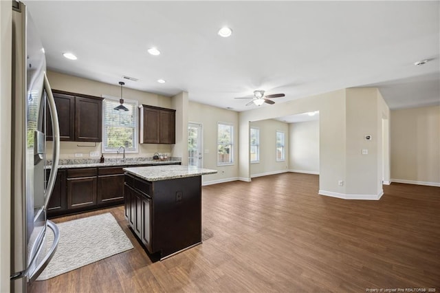 4644 Woodline Dr, Fayetteville, NC 28314 - kitchen with freestanding refrigerator, open floor plan, ceiling fan, and dark wood-style floors