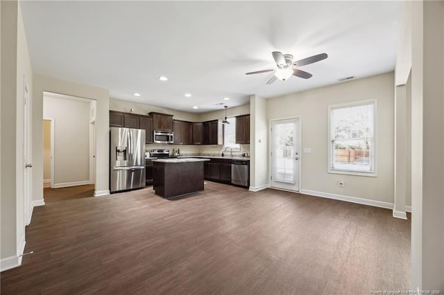 4644 Woodline Dr, Fayetteville, NC 28314 - kitchen with dark brown cabinets, baseboards, appliances with stainless steel finishes, and a ceiling fan