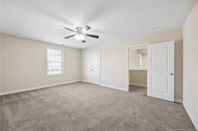4644 Woodline Dr, Fayetteville, NC 28314 - unfurnished bedroom with carpet, baseboards, a ceiling fan, and a closet