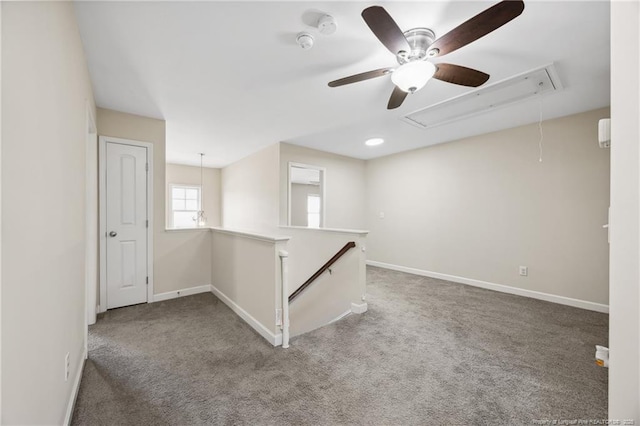 4644 Woodline Dr, Fayetteville, NC 28314 - carpeted spare room featuring attic access, baseboards, and a ceiling fan
