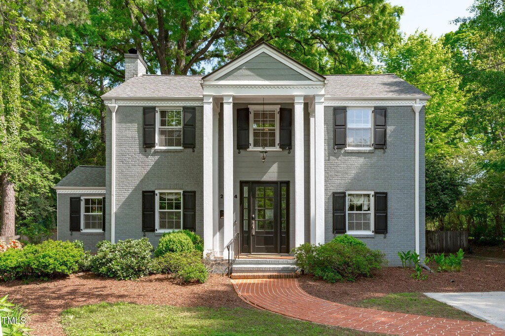 2704 Fairview Rd, Raleigh, NC 27608 - greek revival inspired property with brick siding and a chimney