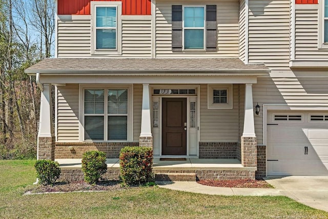 178 Tun Tavern Dr, Cameron, NC 28326 - view of exterior entry with covered porch, a garage, and roof with shingles