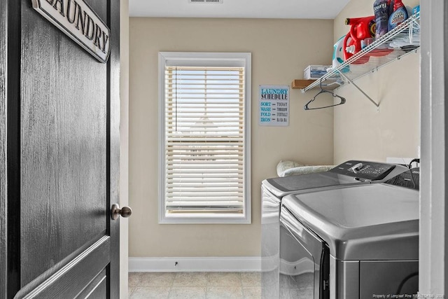 178 Tun Tavern Dr, Cameron, NC 28326 - washroom featuring washing machine and clothes dryer, baseboards, and tile patterned floors
