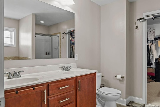 178 Tun Tavern Dr, Cameron, NC 28326 - bathroom with a shower stall, toilet, a walk in closet, and double vanity