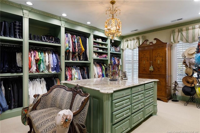 walk in closet featuring visible vents and light colored carpet