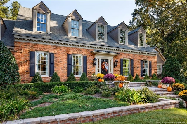 cape cod house with brick siding