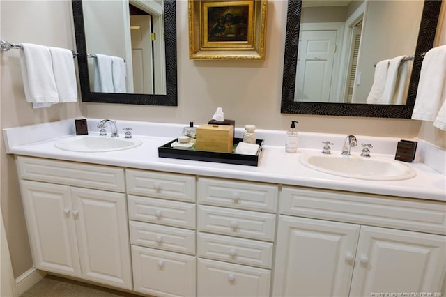 bathroom with double vanity and a sink