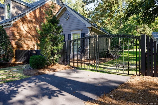 view of gate with fence