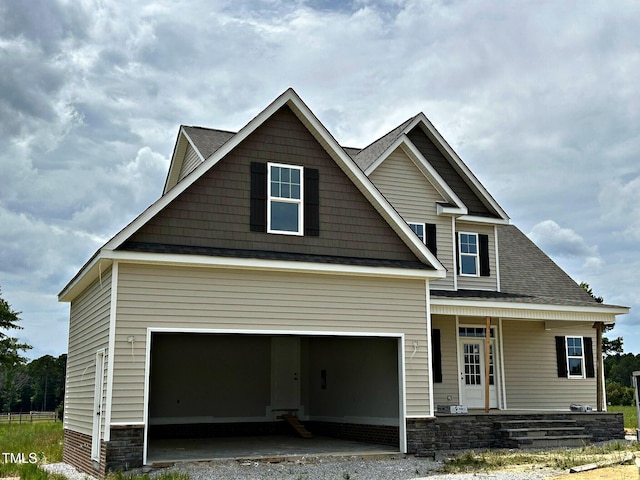 85 Prency Ln, Middlesex, NC 27557 - craftsman-style house featuring a porch, roof with shingles, an attached garage, and driveway