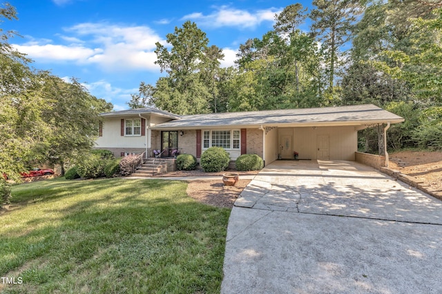 1920 Hillock Dr, Raleigh, NC 27612 - tri-level home featuring a front lawn, driveway, a carport, and brick siding