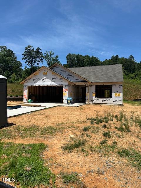12 Crow Field St, Roxboro, NC 27574 - property in mid-construction with an attached garage and driveway