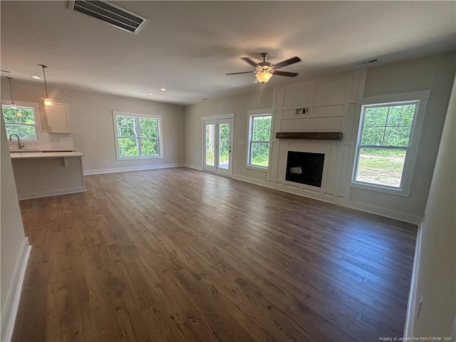 505 Chason Rd, Lumber Bridge, NC 28357 - unfurnished living room with a ceiling fan, dark wood-style floors, baseboards, a fireplace, and recessed lighting