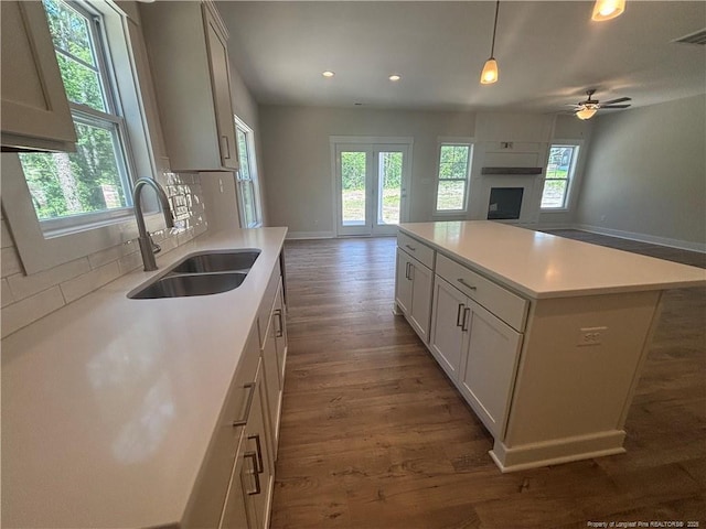 505 Chason Rd, Lumber Bridge, NC 28357 - kitchen featuring a sink, open floor plan, baseboards, dark wood-type flooring, and recessed lighting
