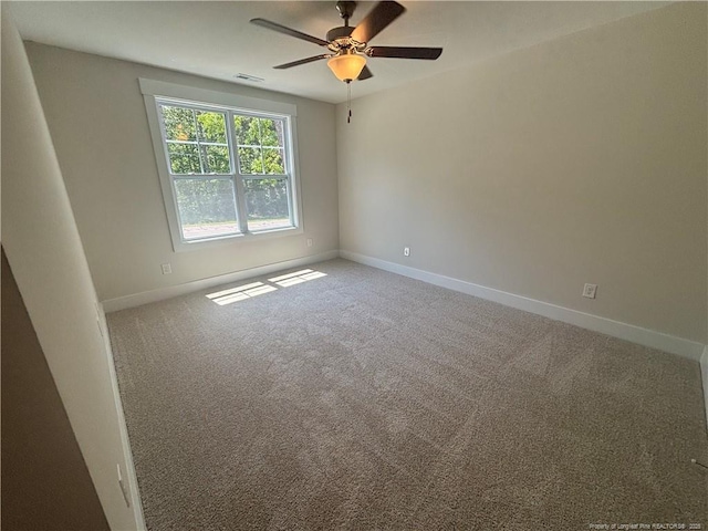 505 Chason Rd, Lumber Bridge, NC 28357 - spare room with baseboards, ceiling fan, and carpet flooring