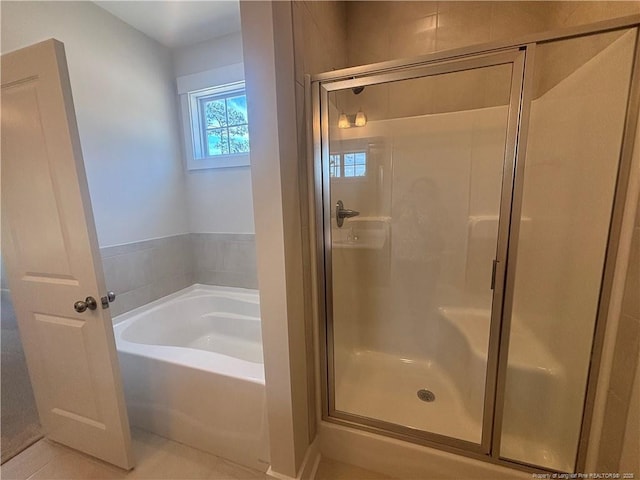 505 Chason Rd, Lumber Bridge, NC 28357 - bathroom featuring a garden tub, a shower stall, and tile patterned floors