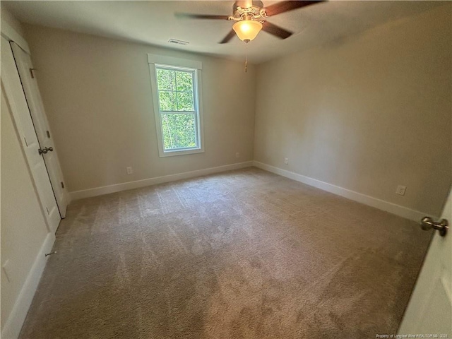 505 Chason Rd, Lumber Bridge, NC 28357 - spare room featuring ceiling fan, light colored carpet, and baseboards