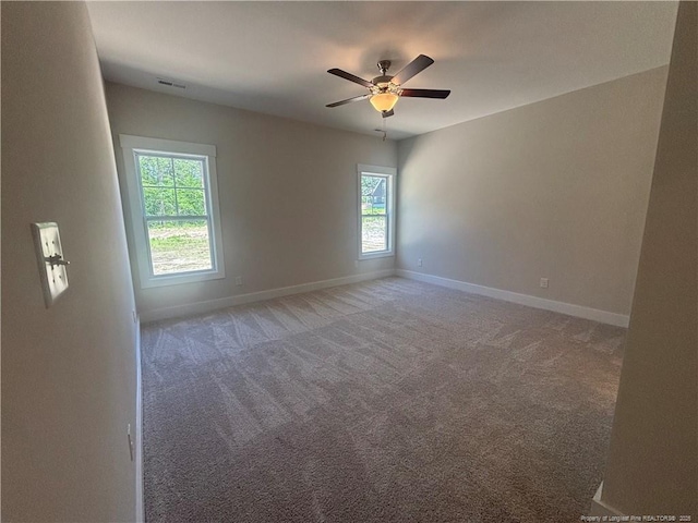 505 Chason Rd, Lumber Bridge, NC 28357 - unfurnished room featuring light colored carpet, baseboards, and ceiling fan