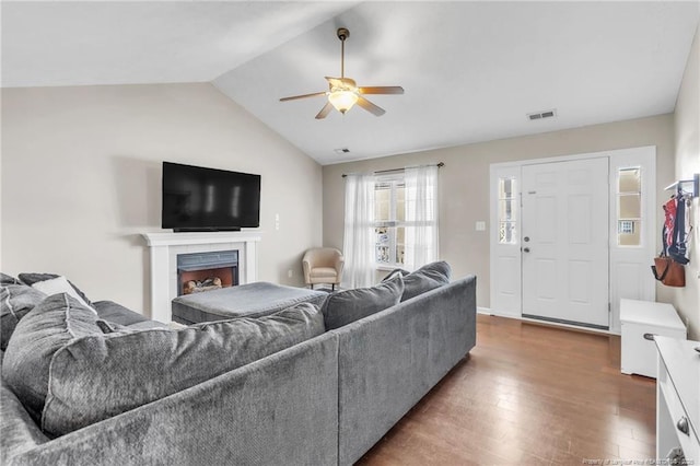 2220 Chasewater Rd, Fayetteville, NC 28306 - living area with ceiling fan, visible vents, a fireplace, wood finished floors, and lofted ceiling