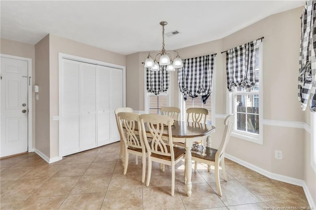 2220 Chasewater Rd, Fayetteville, NC 28306 - dining space featuring baseboards, an inviting chandelier, light tile patterned floors, and visible vents