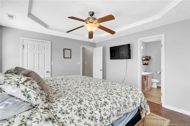 2220 Chasewater Rd, Fayetteville, NC 28306 - bedroom with a ceiling fan, visible vents, a raised ceiling, ornamental molding, and ensuite bath
