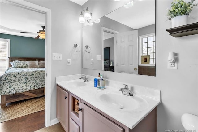 2220 Chasewater Rd, Fayetteville, NC 28306 - bathroom with connected bathroom, double vanity, a ceiling fan, and a sink