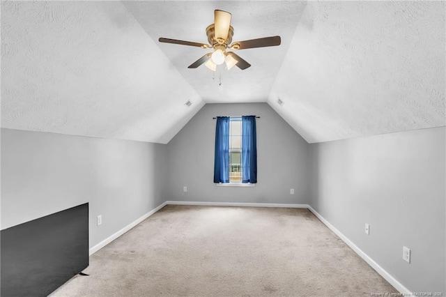 2220 Chasewater Rd, Fayetteville, NC 28306 - additional living space with a ceiling fan, a textured ceiling, carpet floors, baseboards, and lofted ceiling