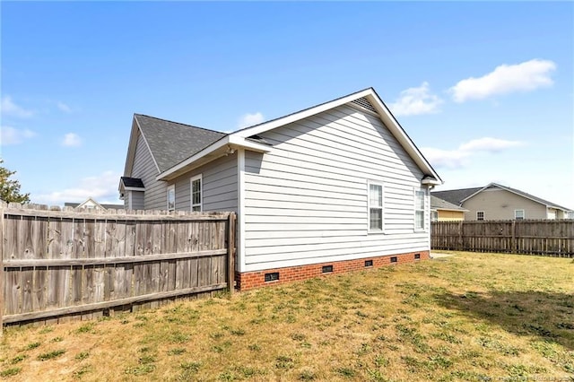 2220 Chasewater Rd, Fayetteville, NC 28306 - view of side of home with a fenced backyard, roof with shingles, a yard, and crawl space