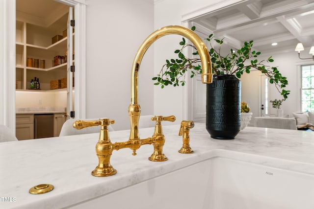 details with a sink, ornamental molding, and recessed lighting