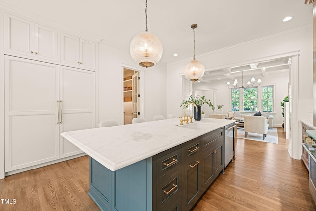kitchen with stainless steel dishwasher, ornamental molding, white cabinetry, a sink, and light wood finished floors