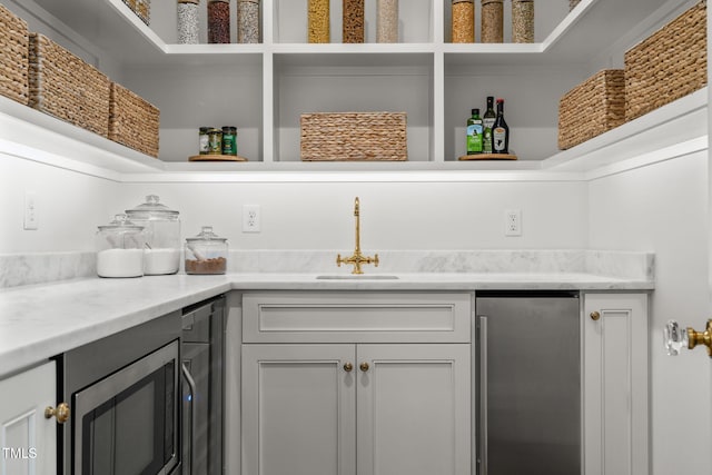 pantry with a sink