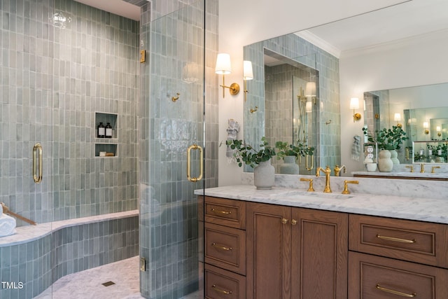 bathroom with crown molding, vanity, and a stall shower