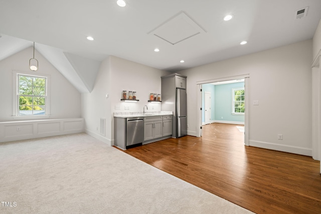 kitchen with visible vents, a sink, gray cabinets, and appliances with stainless steel finishes