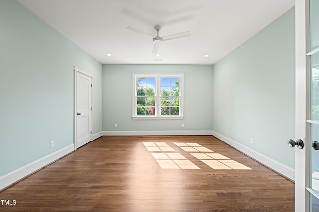 empty room with baseboards, recessed lighting, ceiling fan, and wood finished floors