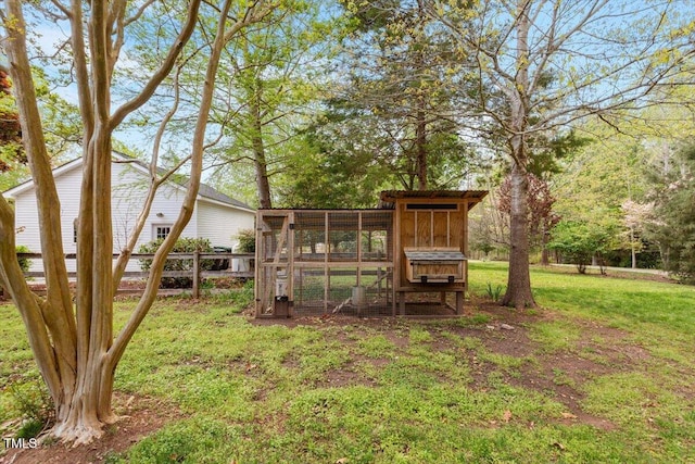 view of yard with an outdoor structure and exterior structure