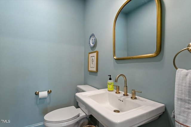 bathroom featuring a sink and toilet