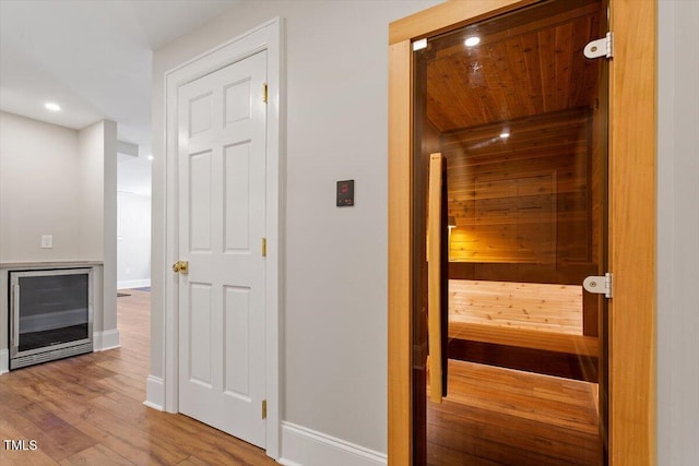 view of sauna / steam room with wood finished floors, baseboards, and recessed lighting