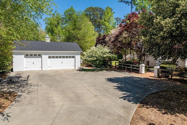 detached garage with fence