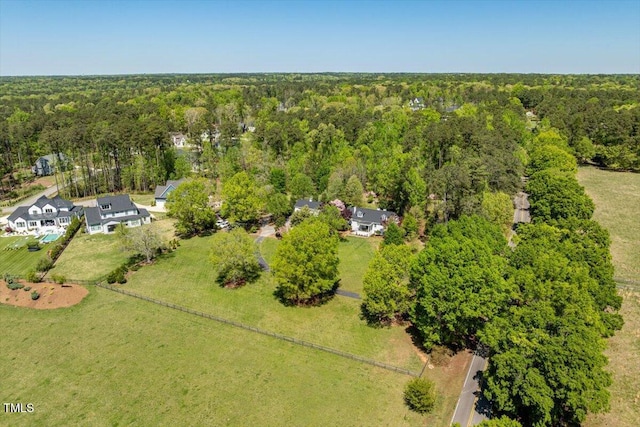bird's eye view featuring a forest view